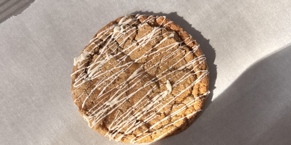 a chai spice cookie with white chocolate drizzle